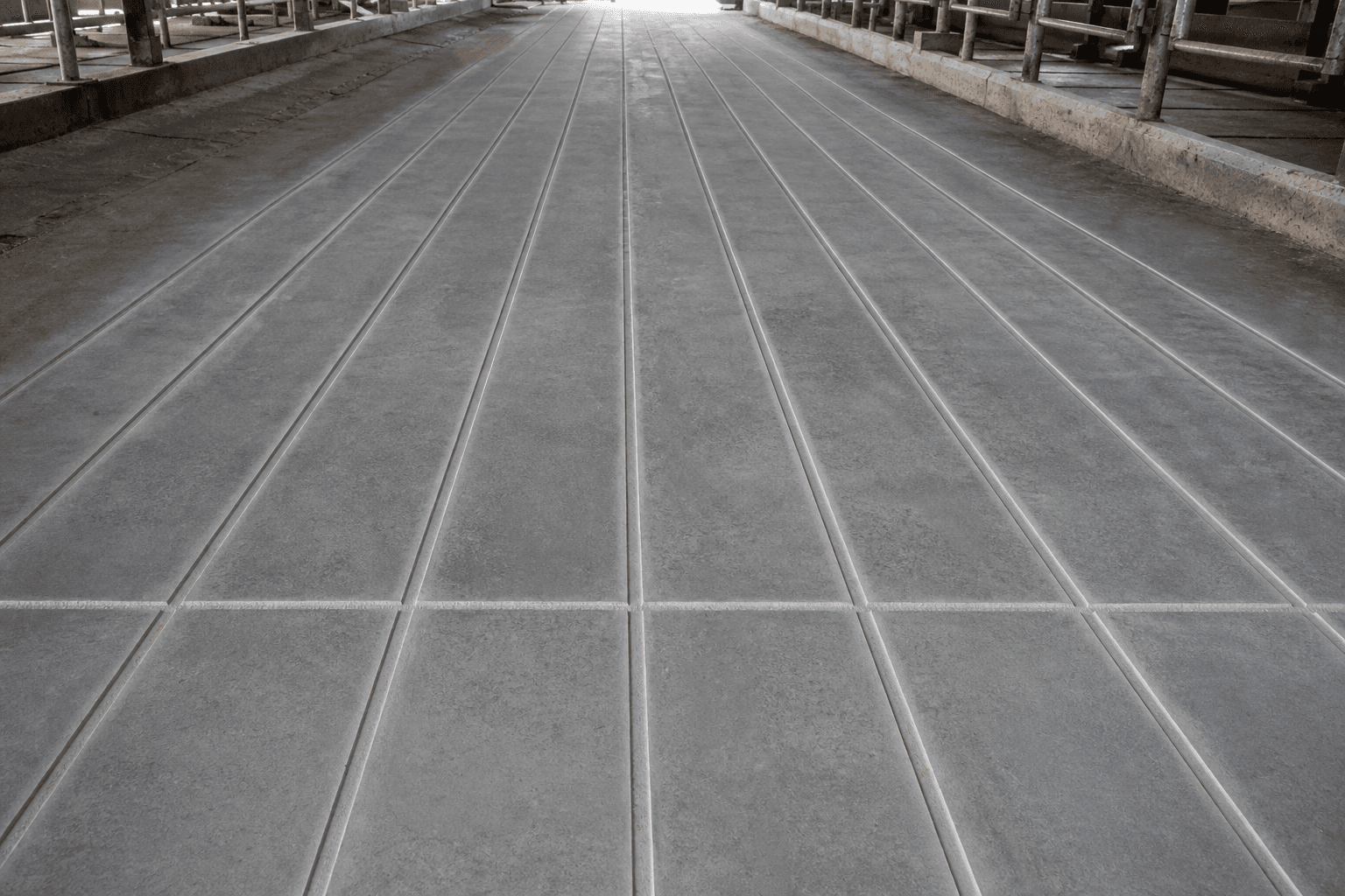 Freshly grooved concrete with sharp square-edged traction grooves