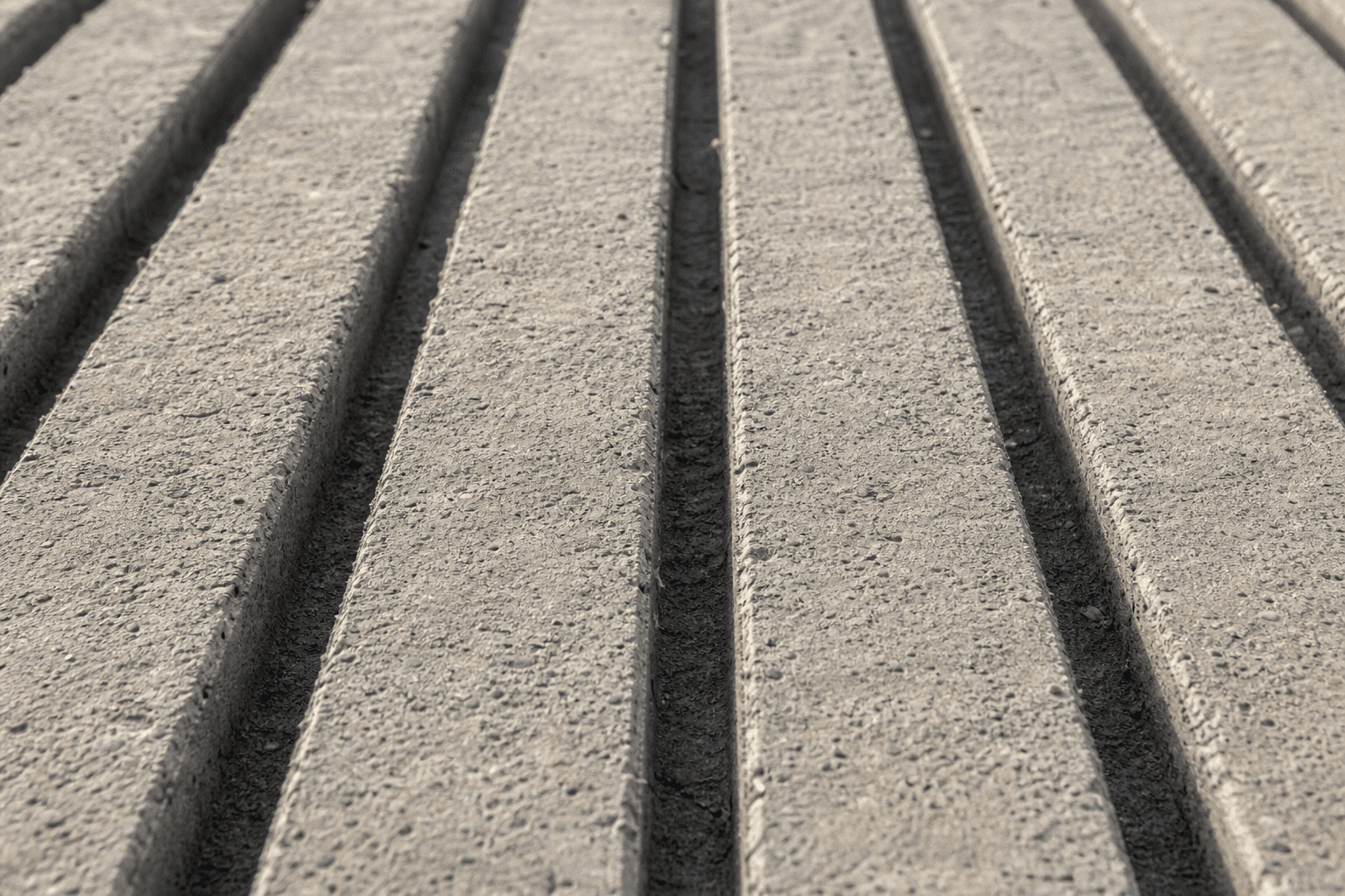 Close-up of straight-line concrete grooving for cattle alleys